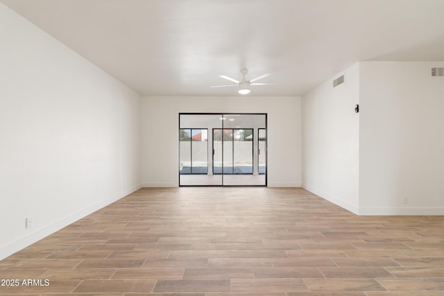 unfurnished room featuring ceiling fan and light wood-type flooring