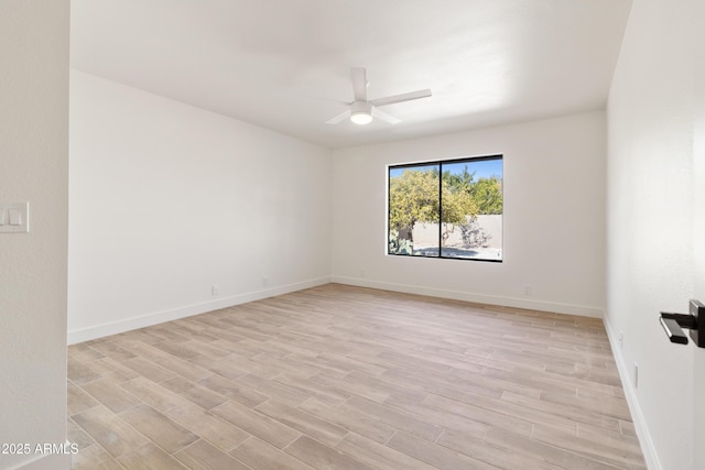 empty room featuring ceiling fan and light wood-type flooring