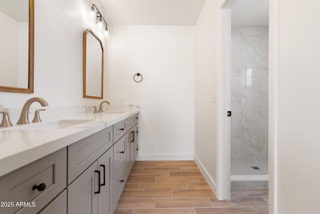 bathroom featuring vanity and a tile shower