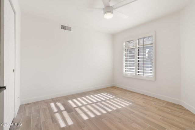 unfurnished room featuring light hardwood / wood-style floors and ceiling fan