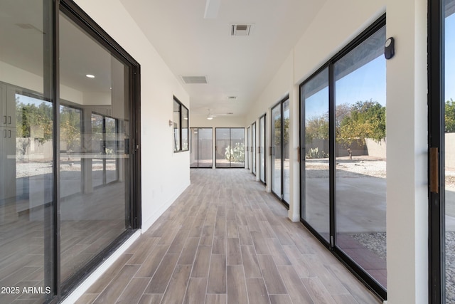 corridor featuring light wood-type flooring