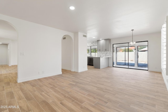 unfurnished living room featuring light hardwood / wood-style floors