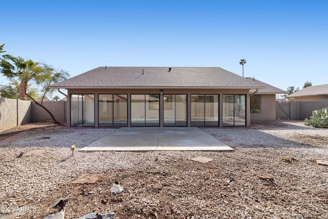 rear view of property featuring a patio