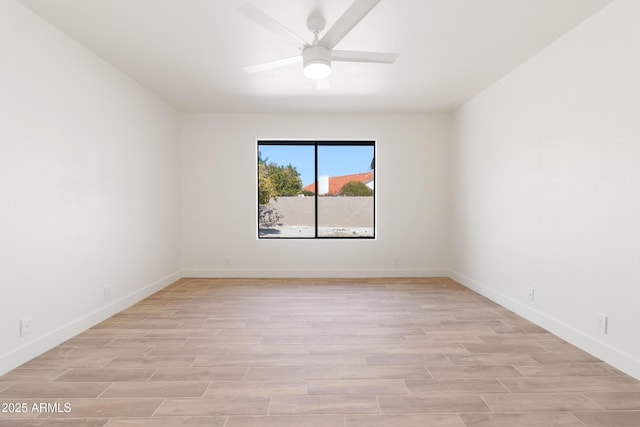 spare room with ceiling fan and light hardwood / wood-style floors