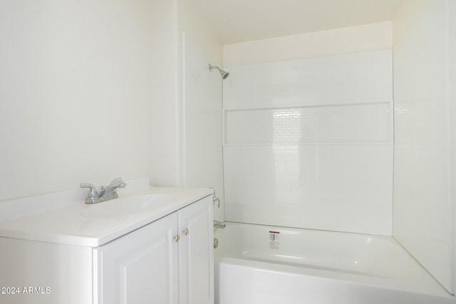 bathroom featuring vanity and tiled shower / bath combo