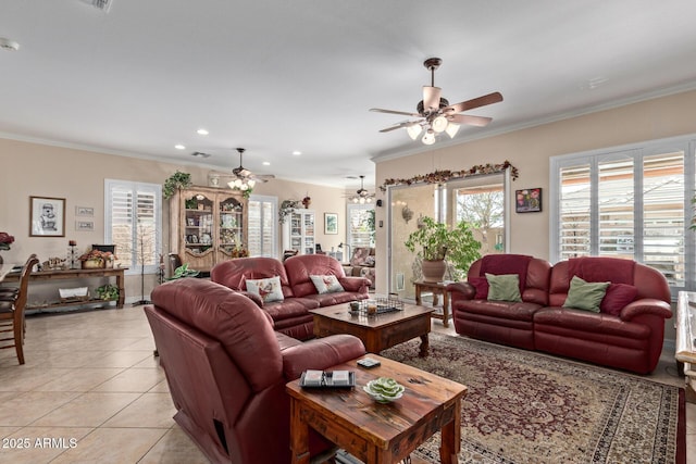 living room with a ceiling fan, light tile patterned flooring, and crown molding