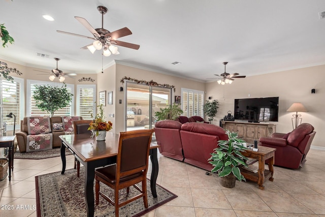 dining area featuring light tile patterned floors, visible vents, and ornamental molding