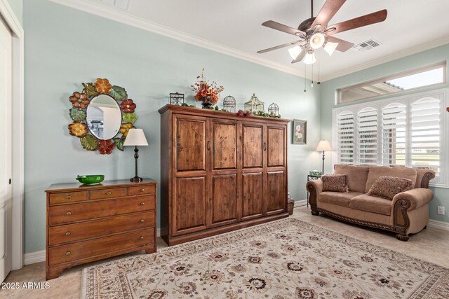 living area with ceiling fan, baseboards, visible vents, and crown molding