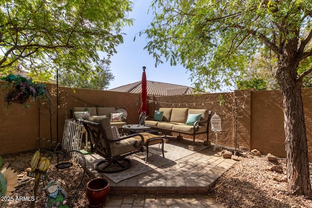 view of patio / terrace featuring outdoor lounge area and a fenced backyard