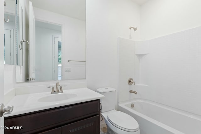 full bathroom with vanity,  shower combination, and toilet