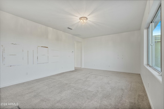 unfurnished room with carpet floors