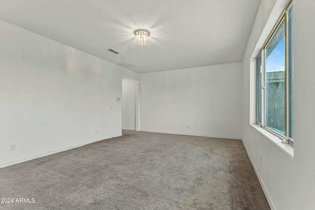 spare room featuring carpet floors