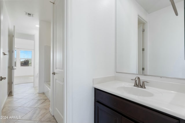 bathroom featuring tile patterned flooring and vanity