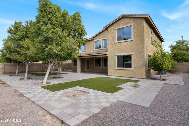 rear view of house with a patio area