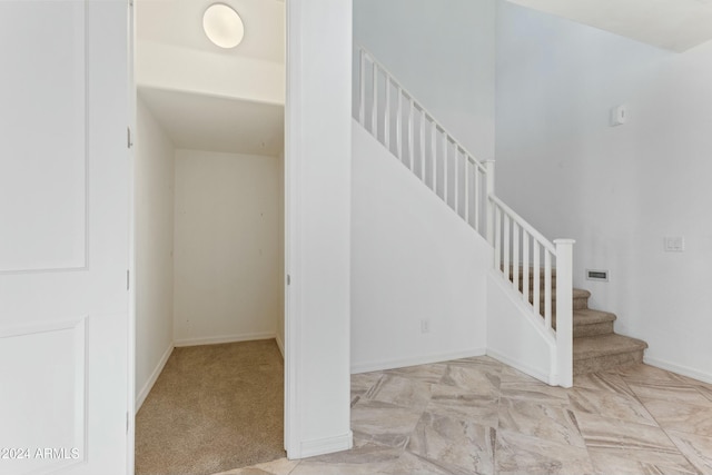 stairs with carpet floors