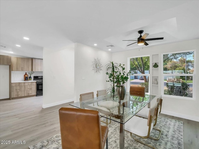 dining area featuring light wood finished floors, recessed lighting, visible vents, ceiling fan, and baseboards