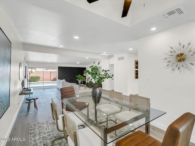 dining room featuring recessed lighting, visible vents, baseboards, and wood finished floors