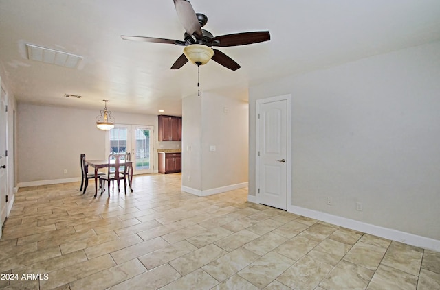 spare room featuring french doors and ceiling fan