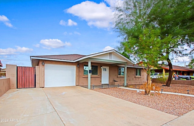 ranch-style house featuring a garage