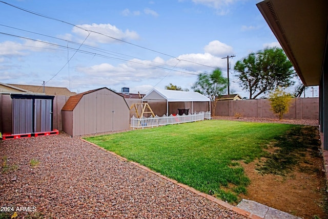 view of yard with a storage unit