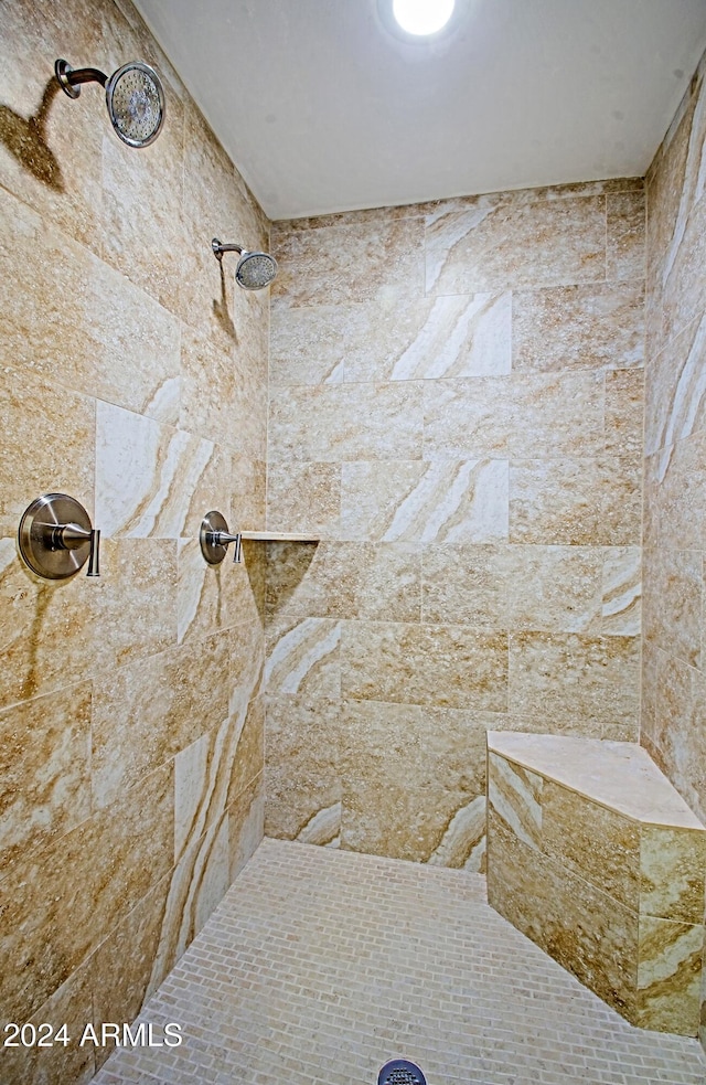 bathroom featuring tiled shower