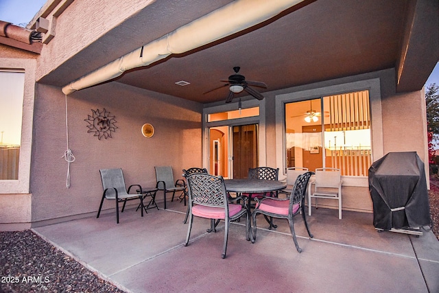 view of patio featuring ceiling fan