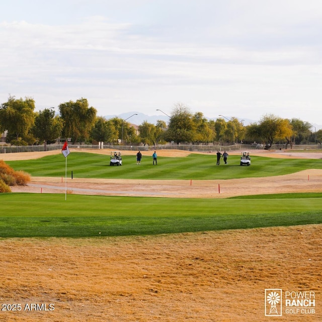 surrounding community with view of golf course