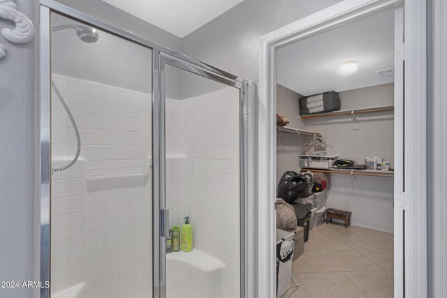 bathroom featuring tile patterned flooring and walk in shower