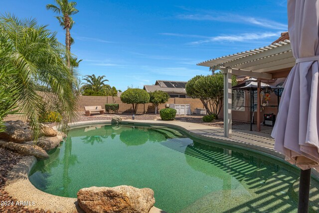 view of swimming pool featuring a pergola and a patio