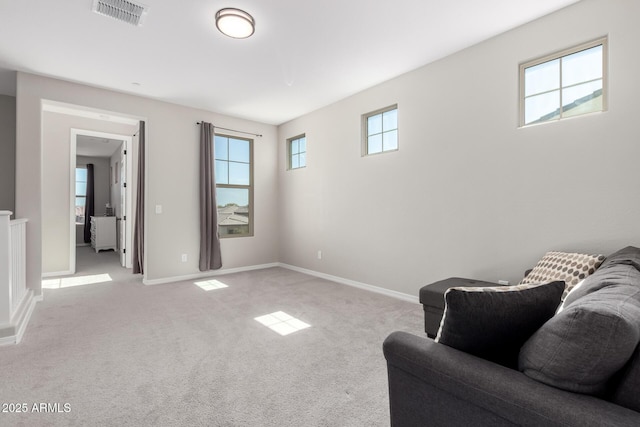 sitting room featuring visible vents, baseboards, and carpet flooring