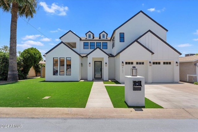 modern inspired farmhouse featuring a front yard and a garage