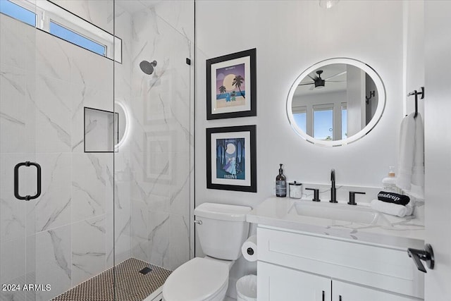 bathroom featuring an enclosed shower, vanity, and toilet