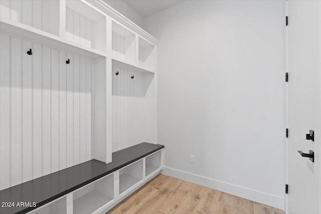 mudroom with light hardwood / wood-style flooring