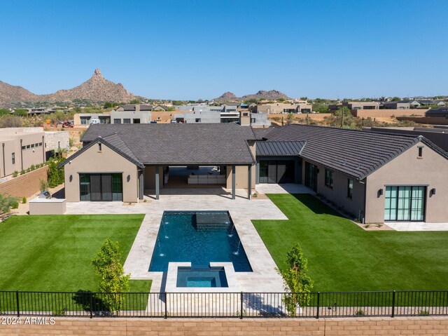 view of patio with ceiling fan and an outdoor fire pit