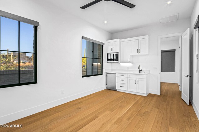 living room with light hardwood / wood-style flooring, beam ceiling, a chandelier, and high vaulted ceiling