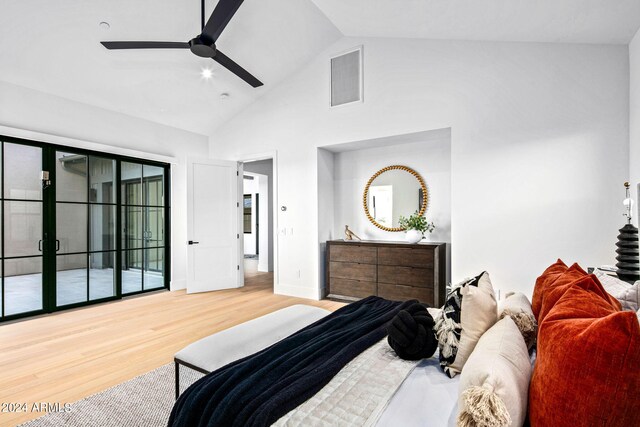 kitchen featuring beamed ceiling, sink, decorative light fixtures, stainless steel appliances, and light hardwood / wood-style floors