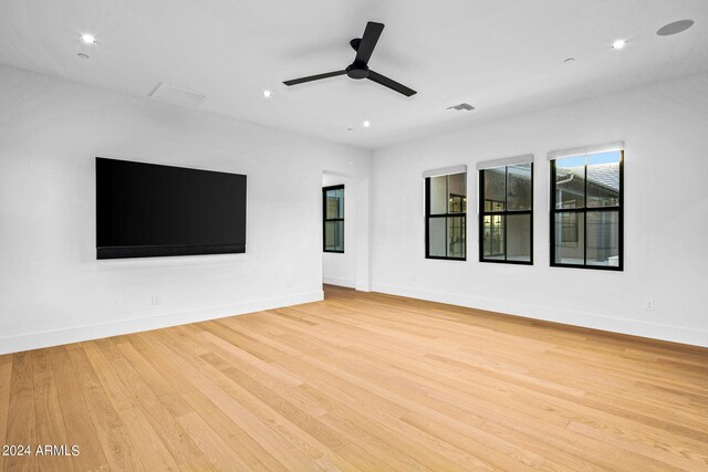 unfurnished living room featuring light hardwood / wood-style flooring and ceiling fan