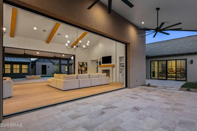 back of house featuring ceiling fan, a yard, and a patio