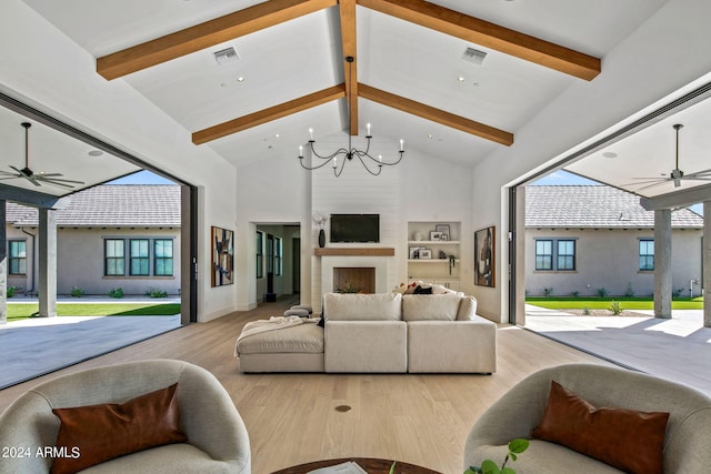 living room with a healthy amount of sunlight and beam ceiling