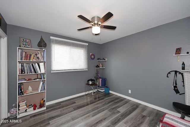 misc room featuring dark hardwood / wood-style flooring and ceiling fan