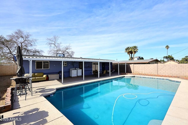 view of swimming pool with an outdoor living space and a patio