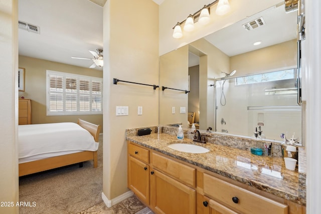 full bathroom with visible vents, ceiling fan, vanity, and walk in shower