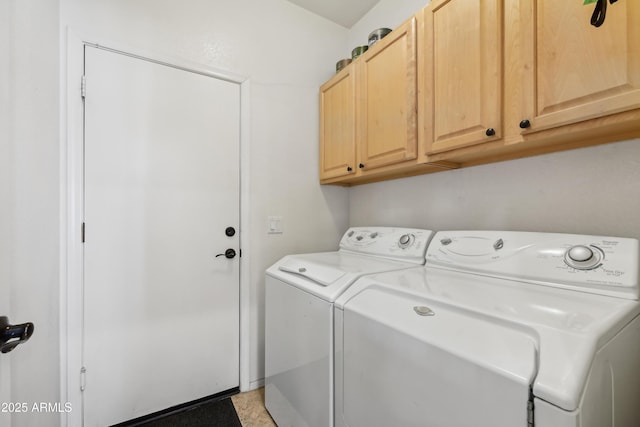 laundry area with cabinet space and separate washer and dryer