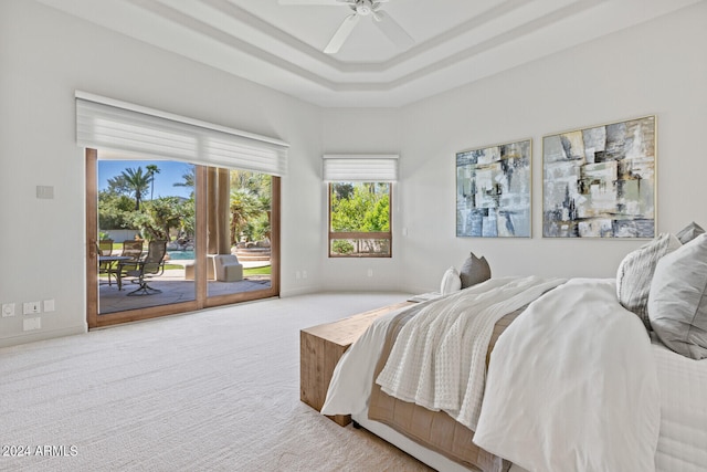 carpeted bedroom featuring ceiling fan and access to exterior