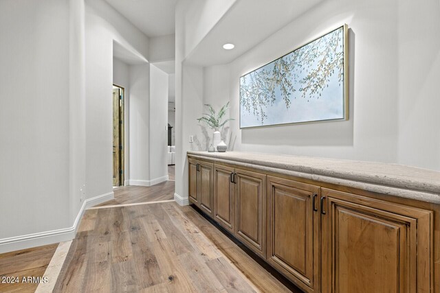 bathroom featuring a tray ceiling, separate shower and tub, ceiling fan, and vanity