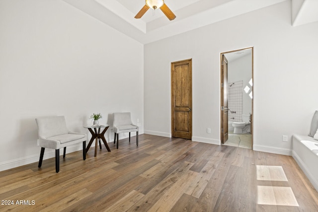 sitting room featuring ceiling fan and hardwood / wood-style floors