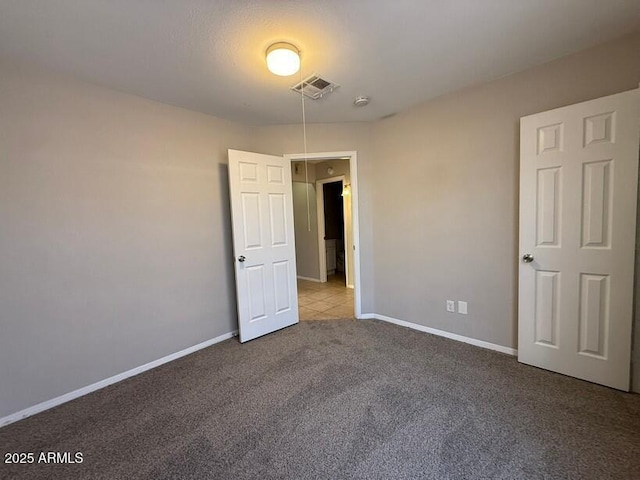 unfurnished room featuring light colored carpet