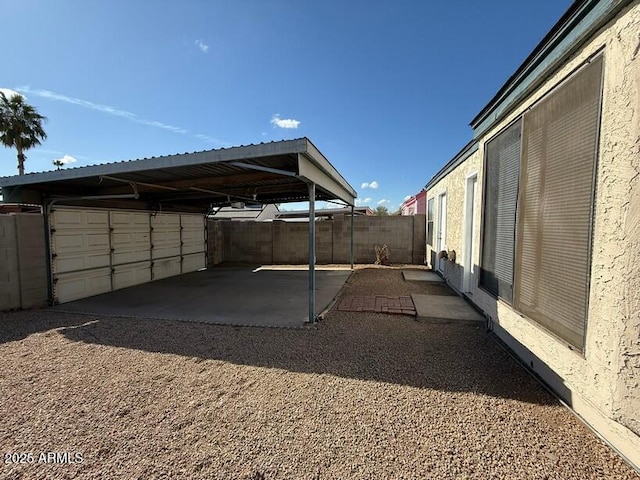 view of parking / parking lot featuring a carport