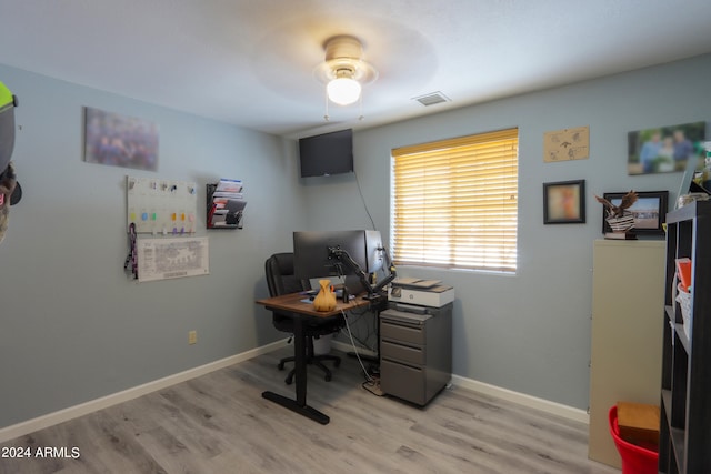 office area with light hardwood / wood-style floors and ceiling fan