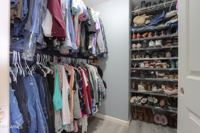 walk in closet featuring wood-type flooring